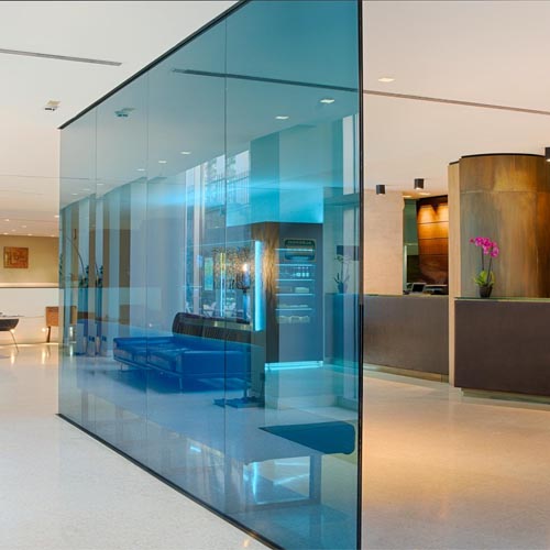 Modern hotel lobby with architectural glass partition design